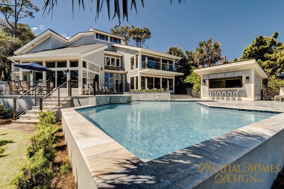 Modern coastal home with elevated infinity pool and outdoor entertainment area